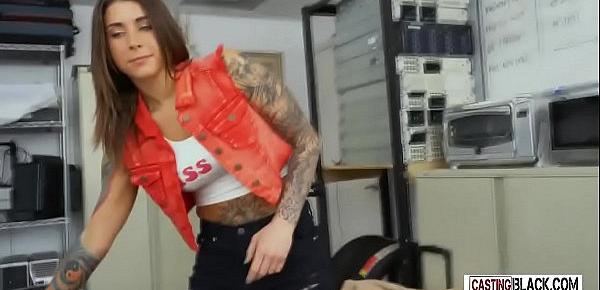  A petite tattooed teen is on her knees waiting to be fucked by a big black dick.
